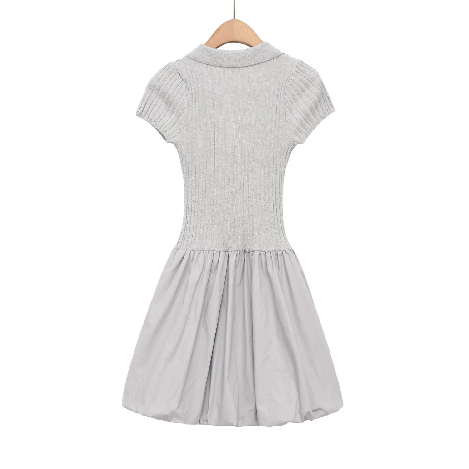Close-up of the ribbed short sleeve cuff on the gray knit dress