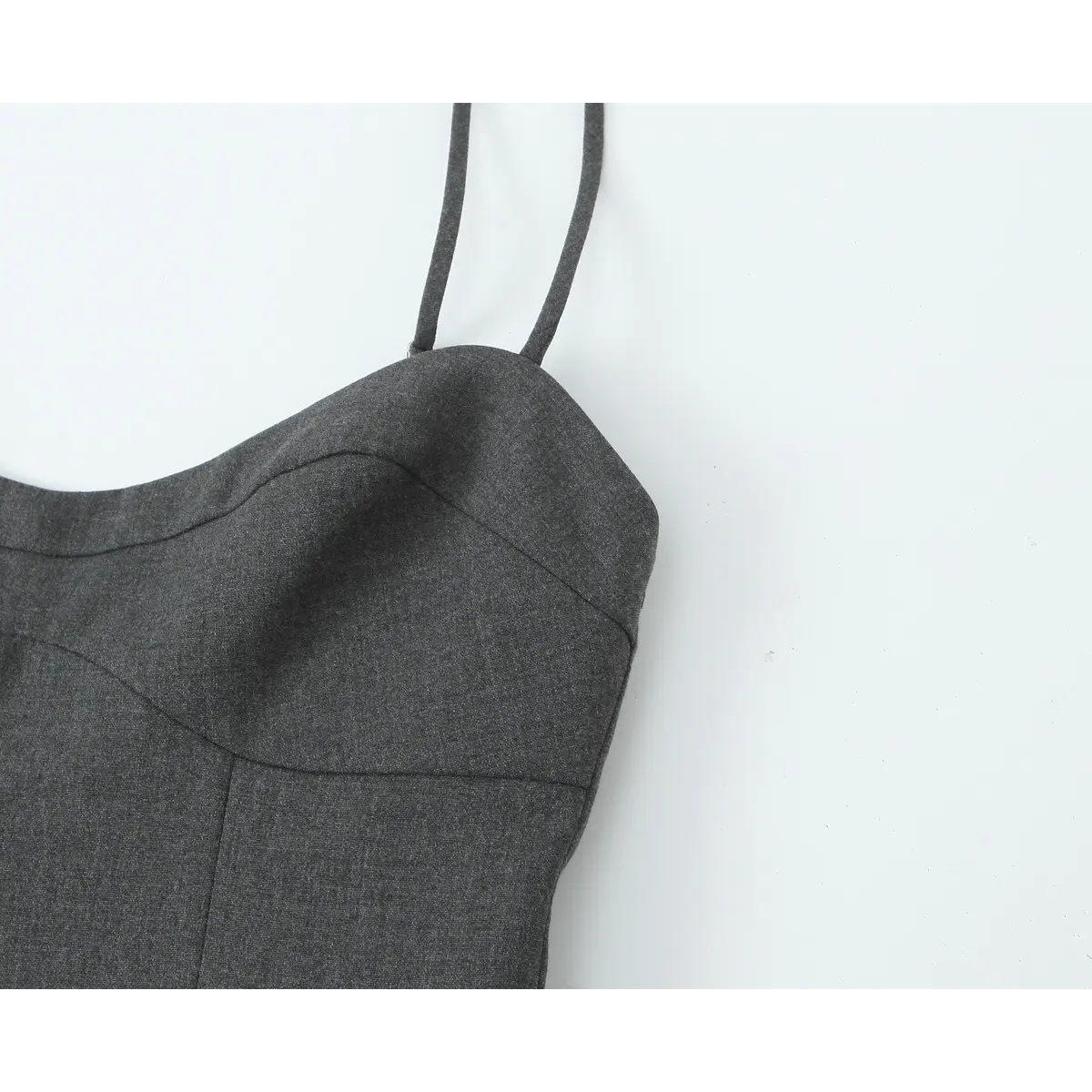 Close-up of the dress's front neckline, highlighting the sculpted sweetheart design and princess seams.