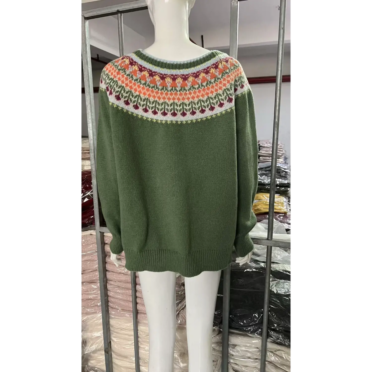 White mannequin back view of green fairisle knit sweater, round neck yoke multi floral jacquard pattern, loose knit pullover