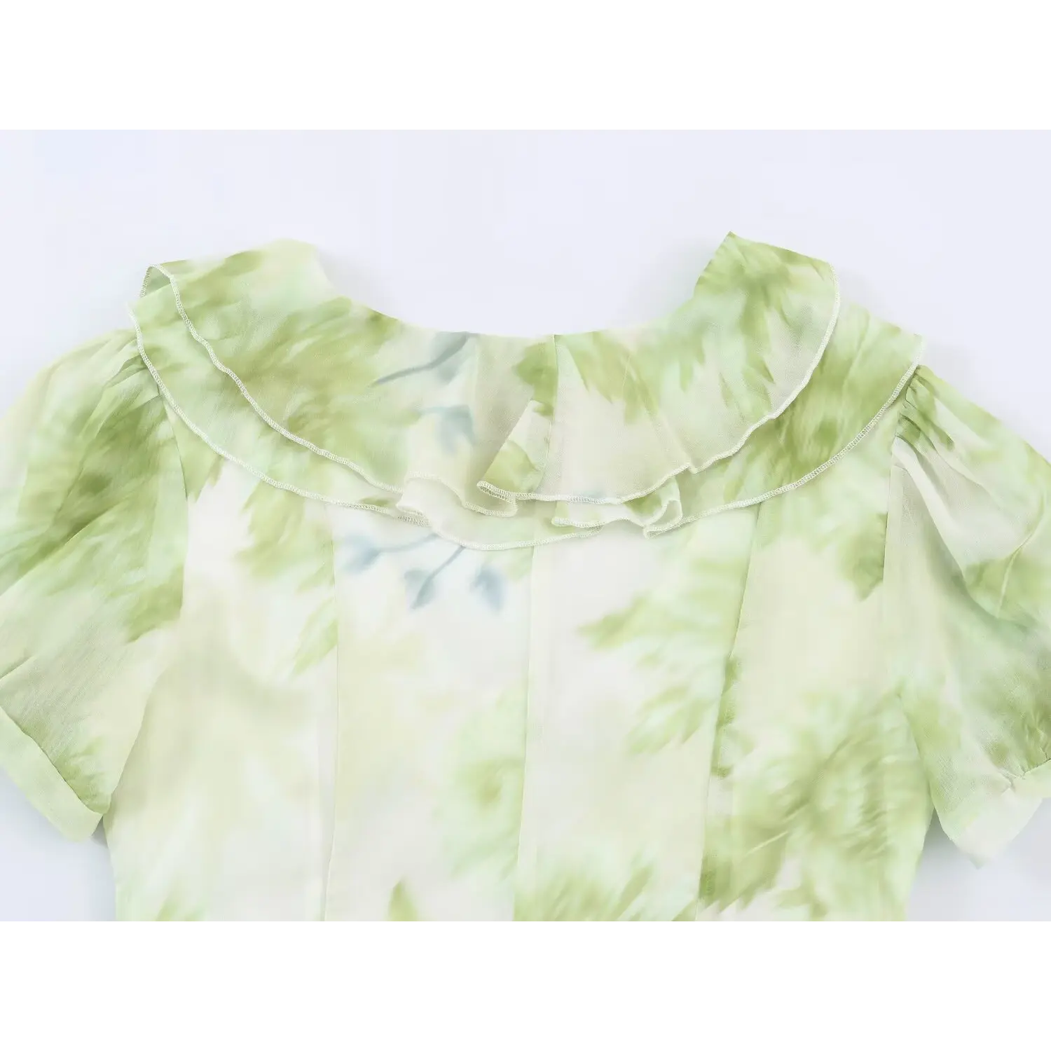 Close‑up of back layered ruffle collar, short puff sleeves on green floral print chiffon maxi dress