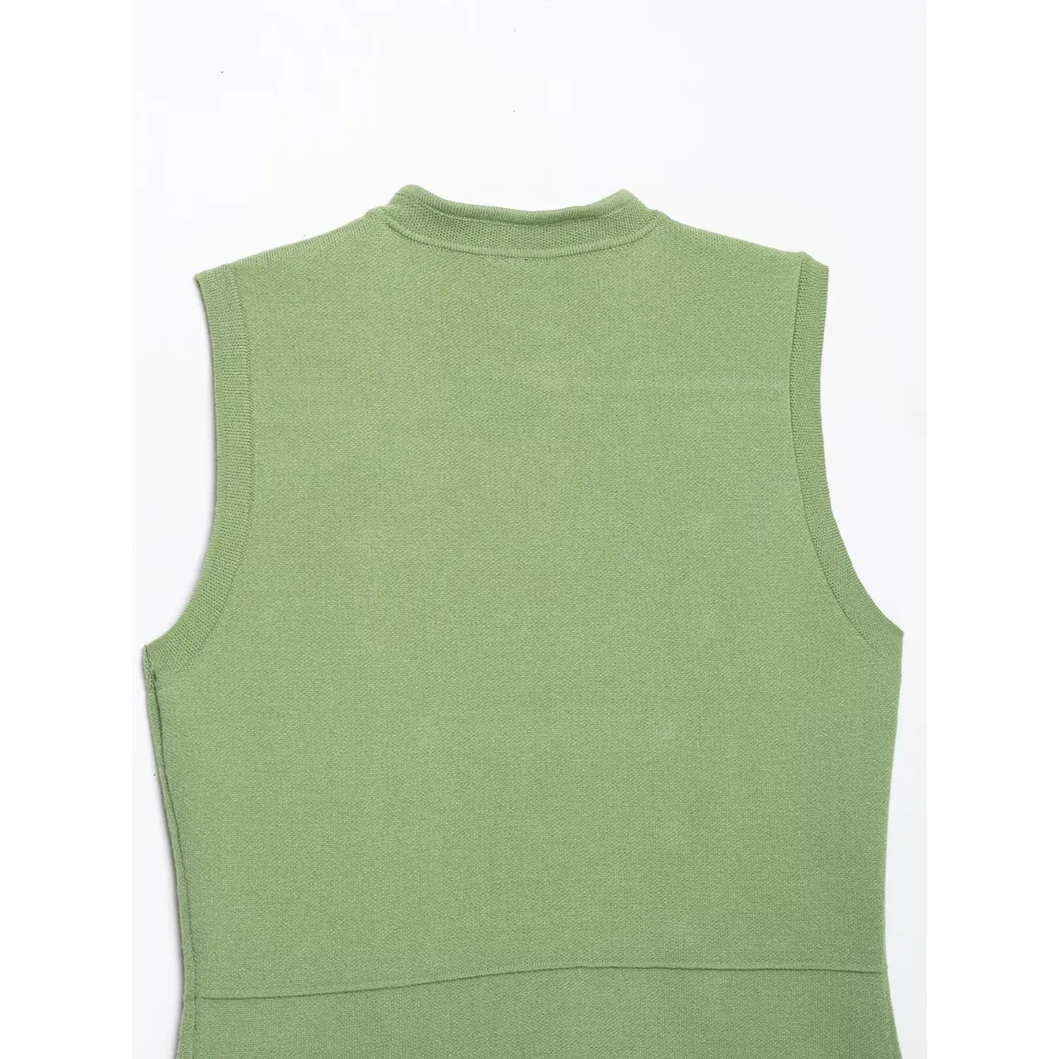 Close‑up of round collar and shoulder knit stitching on back of sage green knit waistcoat