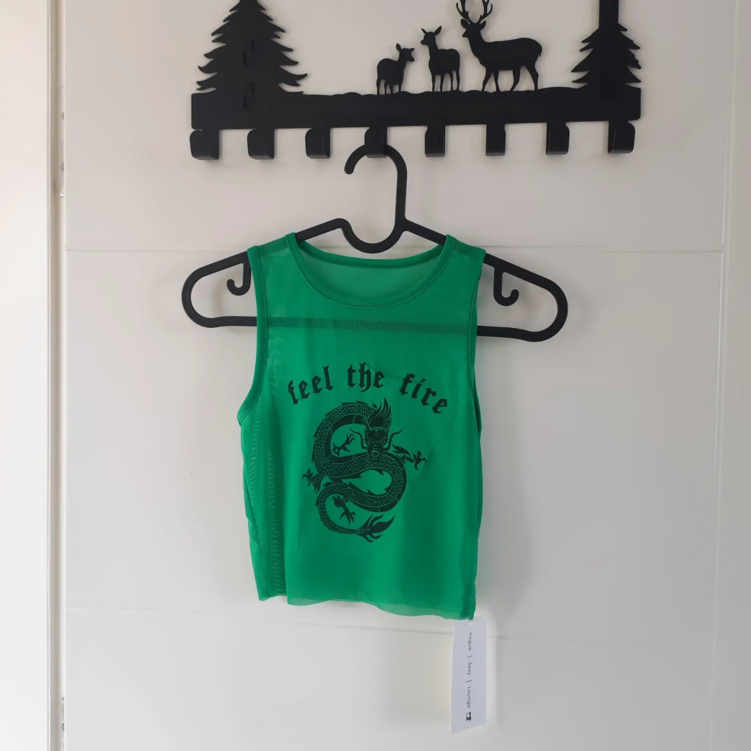 Hanging front view green round neck mesh sleeveless crop tank top with dragon and feel the fire letter print