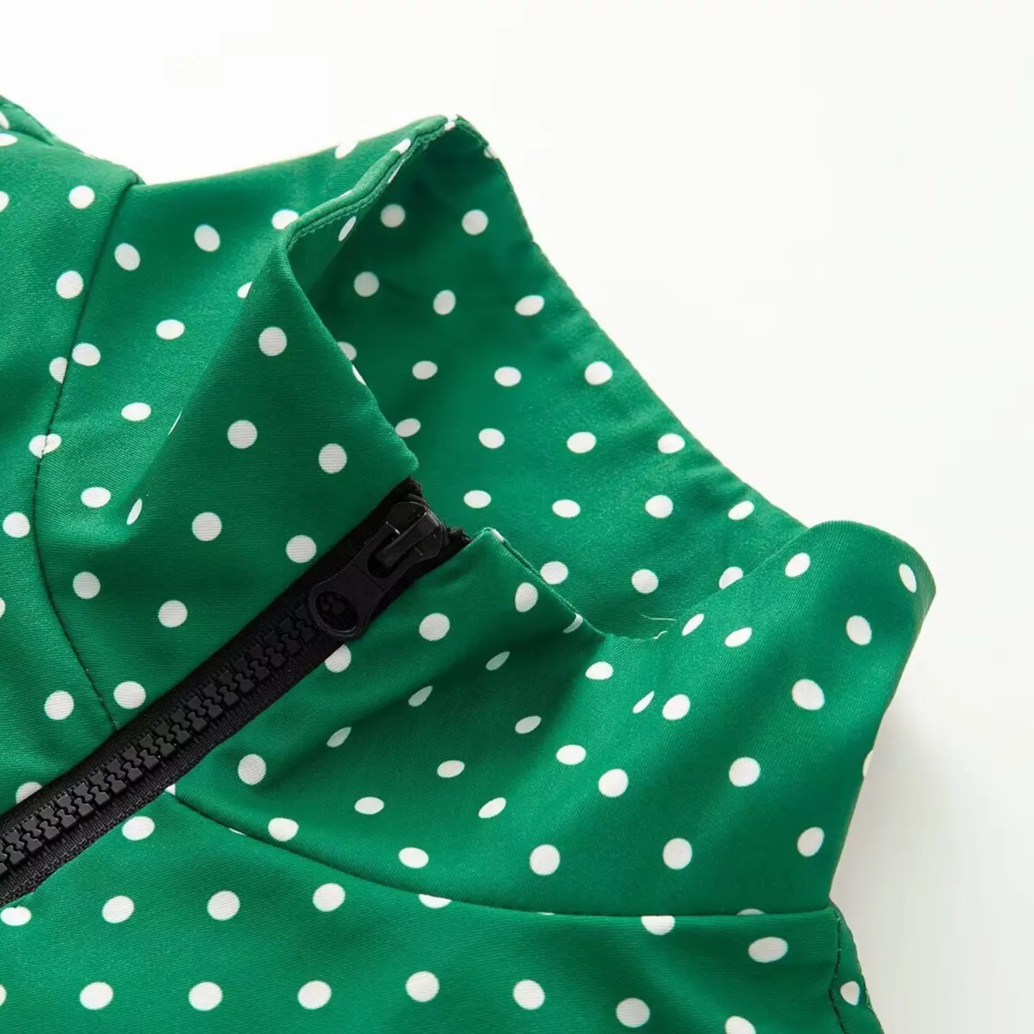 Stand collar and half zipper macro shot of green polka dot casual jacket