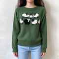 Female model wears forest green knit sweater, cartoon sheep jacquard motif on front chest, raglan long sleeve casual pullover