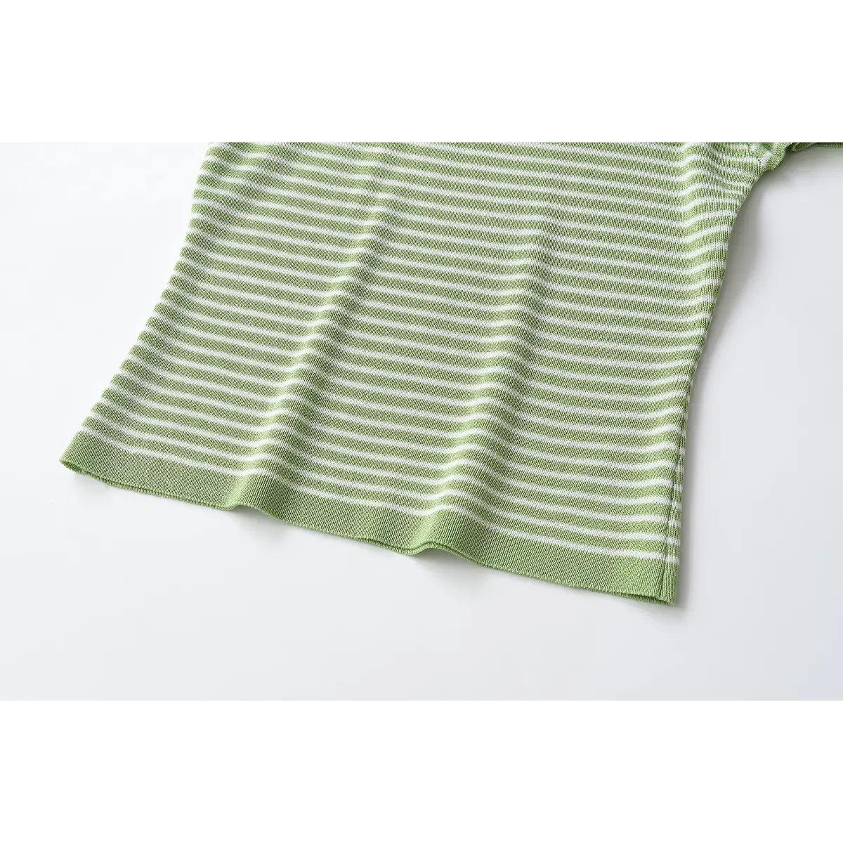  Bottom hem & side seam close of striped off shoulder knit tee