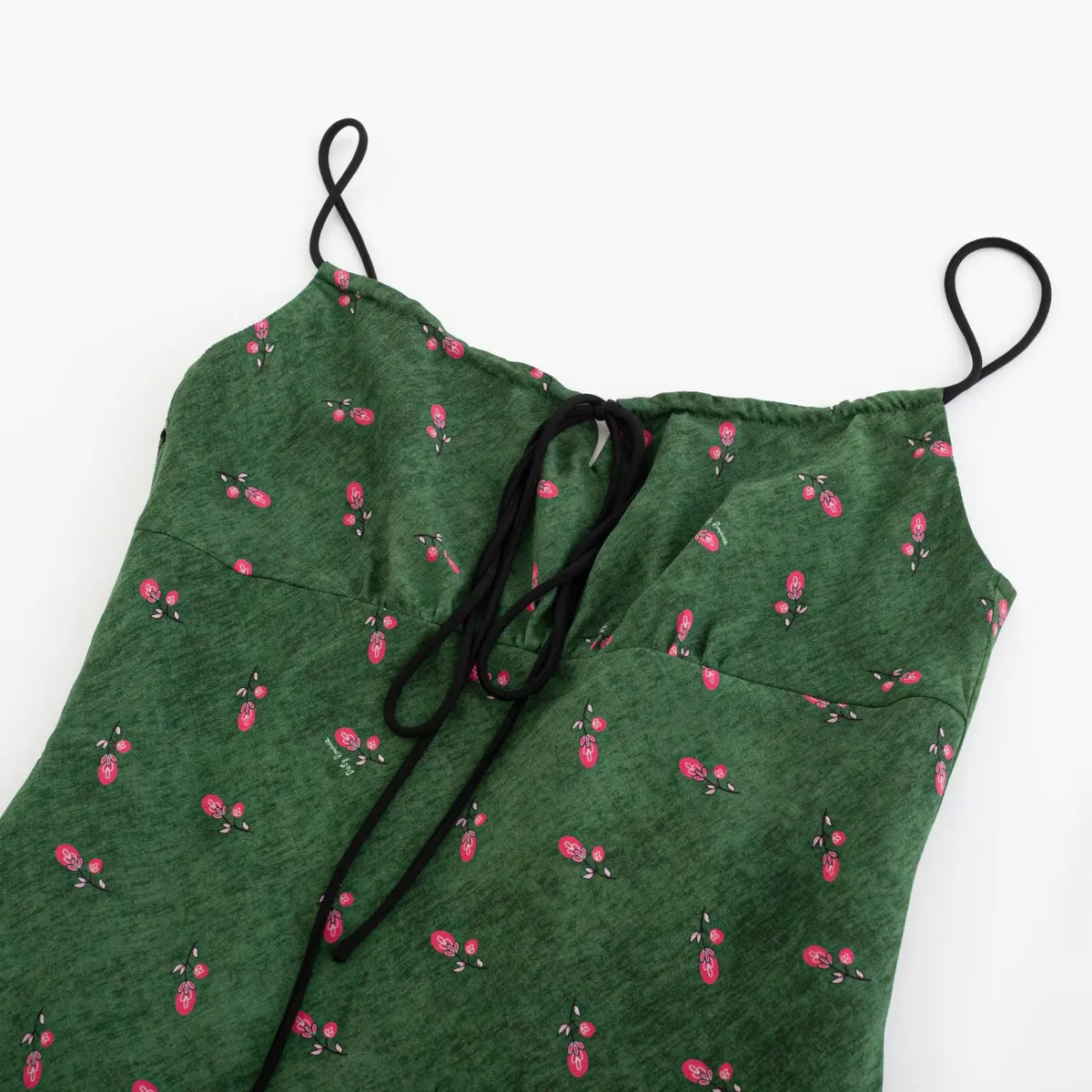 Close‑up of front bust tie knot and spaghetti straps