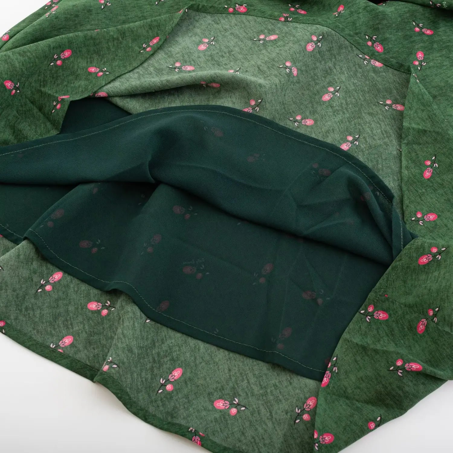 Close‑up of dark green inner lining of cami maxi dress