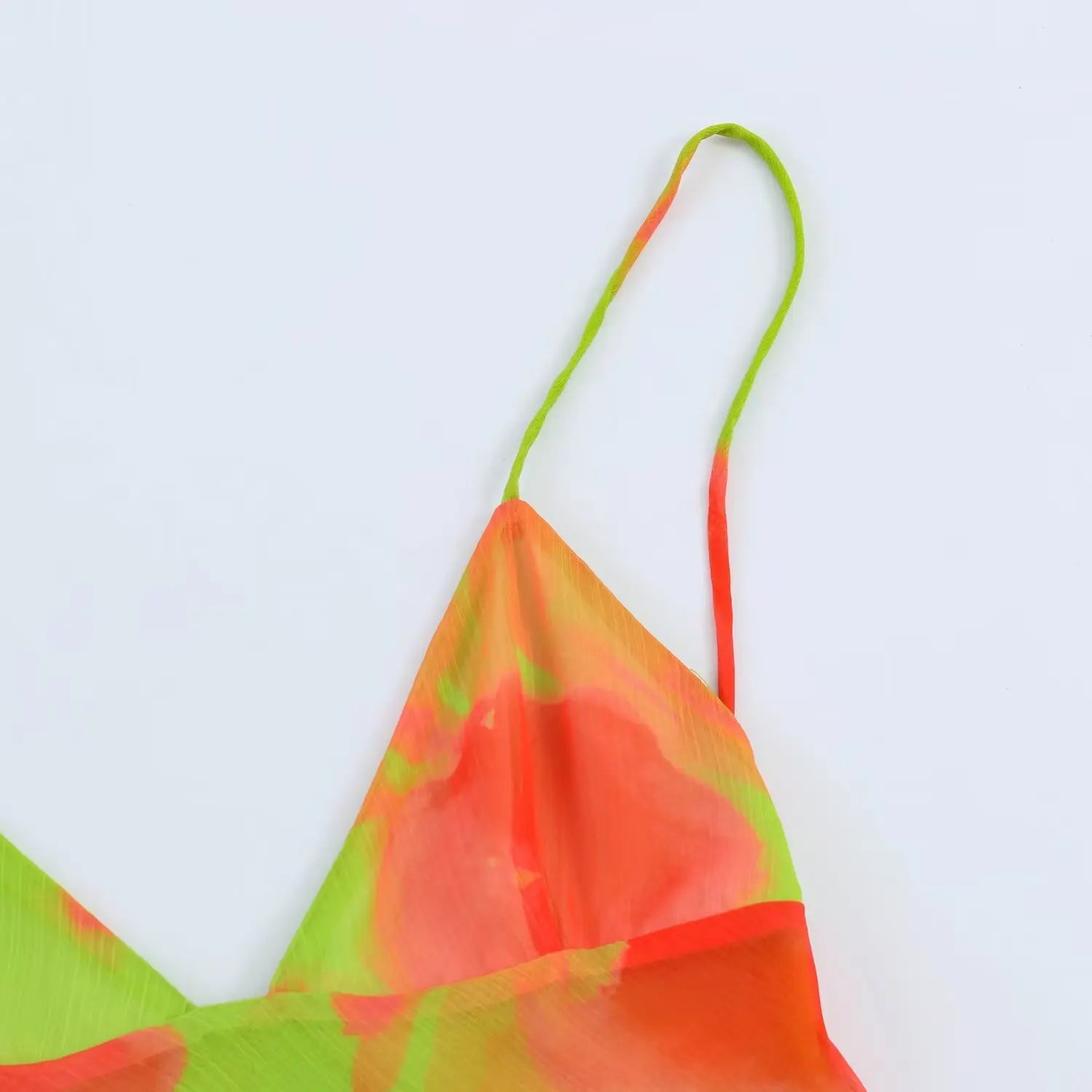 Close‑up of thin spaghetti strap and shoulder seam