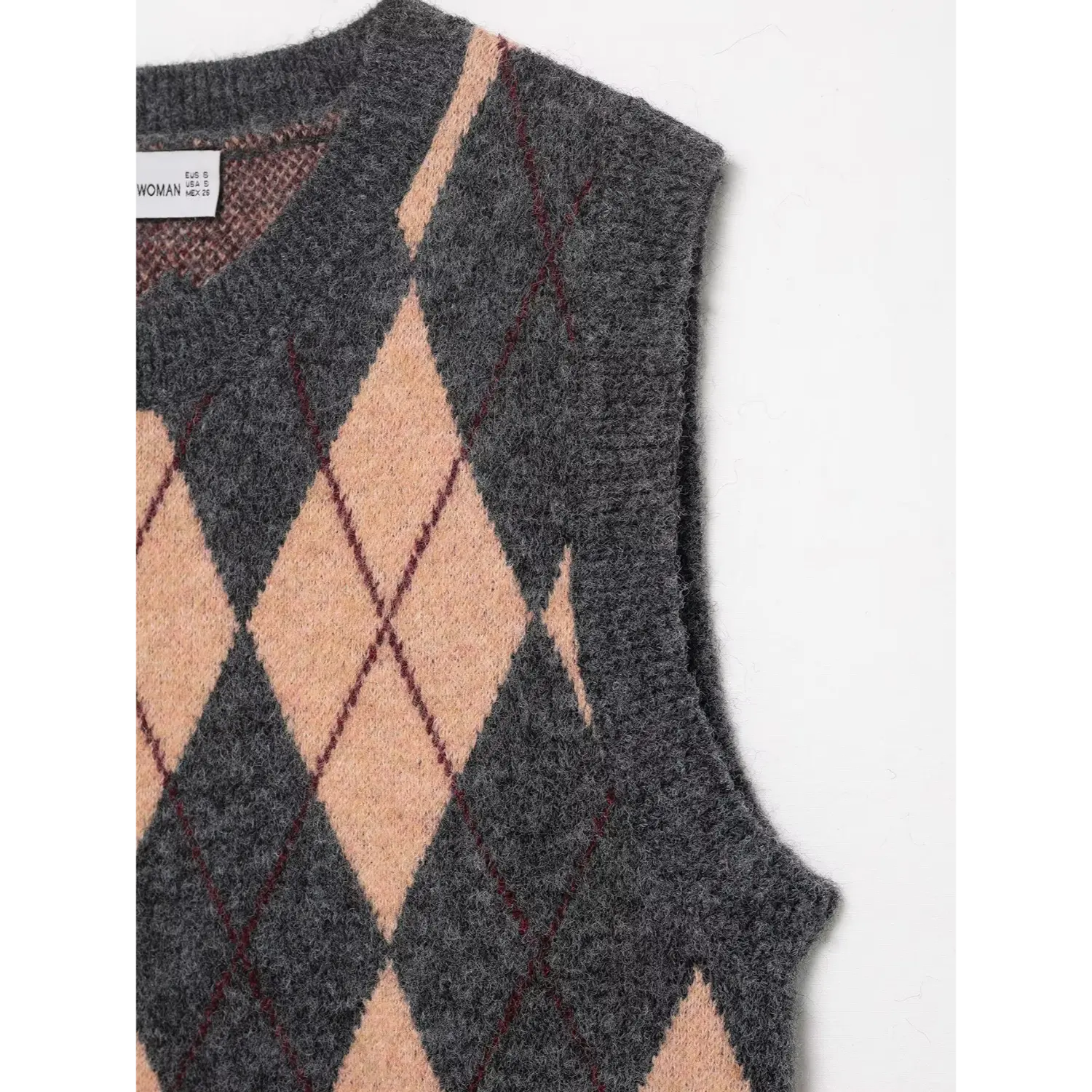 Partial front view showing the crew neckline and both shoulder straps