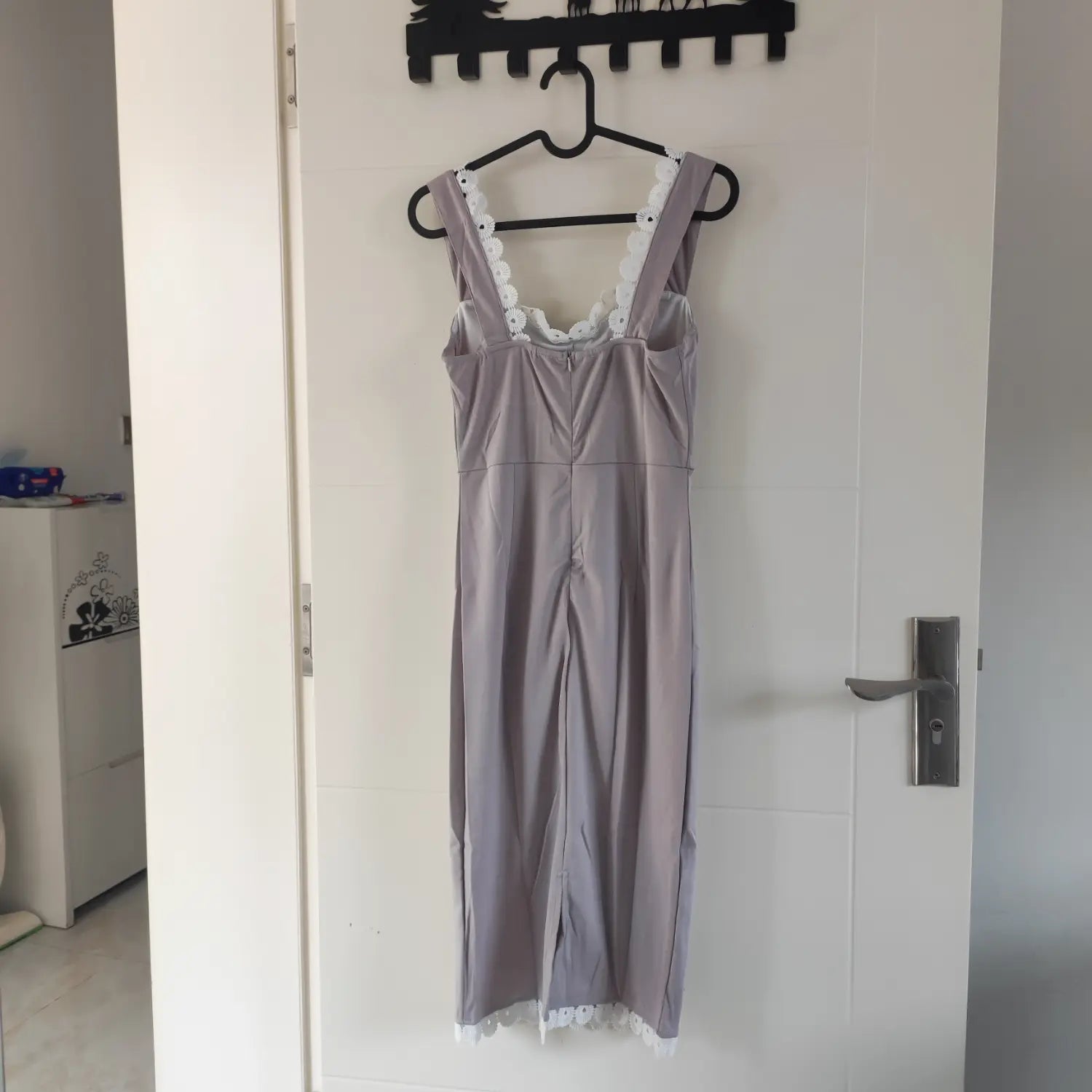 Hanging back full view grey sleeveless fitted midi dress with back zipper and lace hem