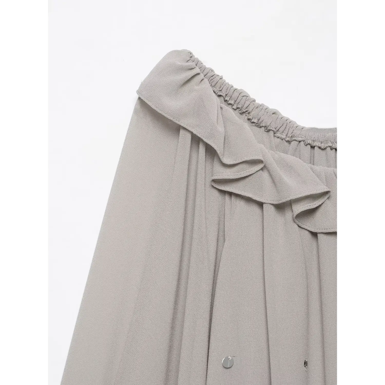Close‑up detail of ruffled elastic off‑shoulder neckline, soft grey lightweight chiffon fabric