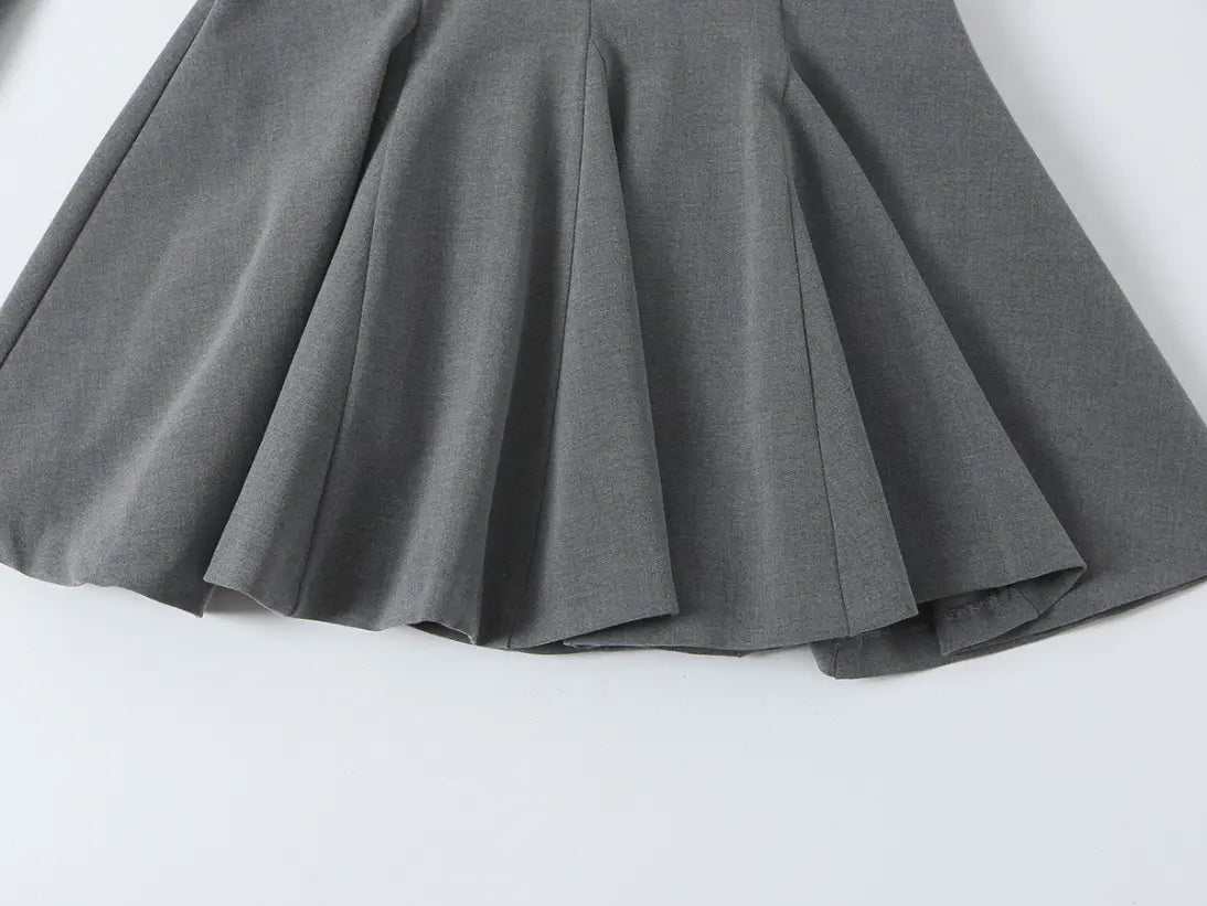 Close-up of flared pleated mini skirt