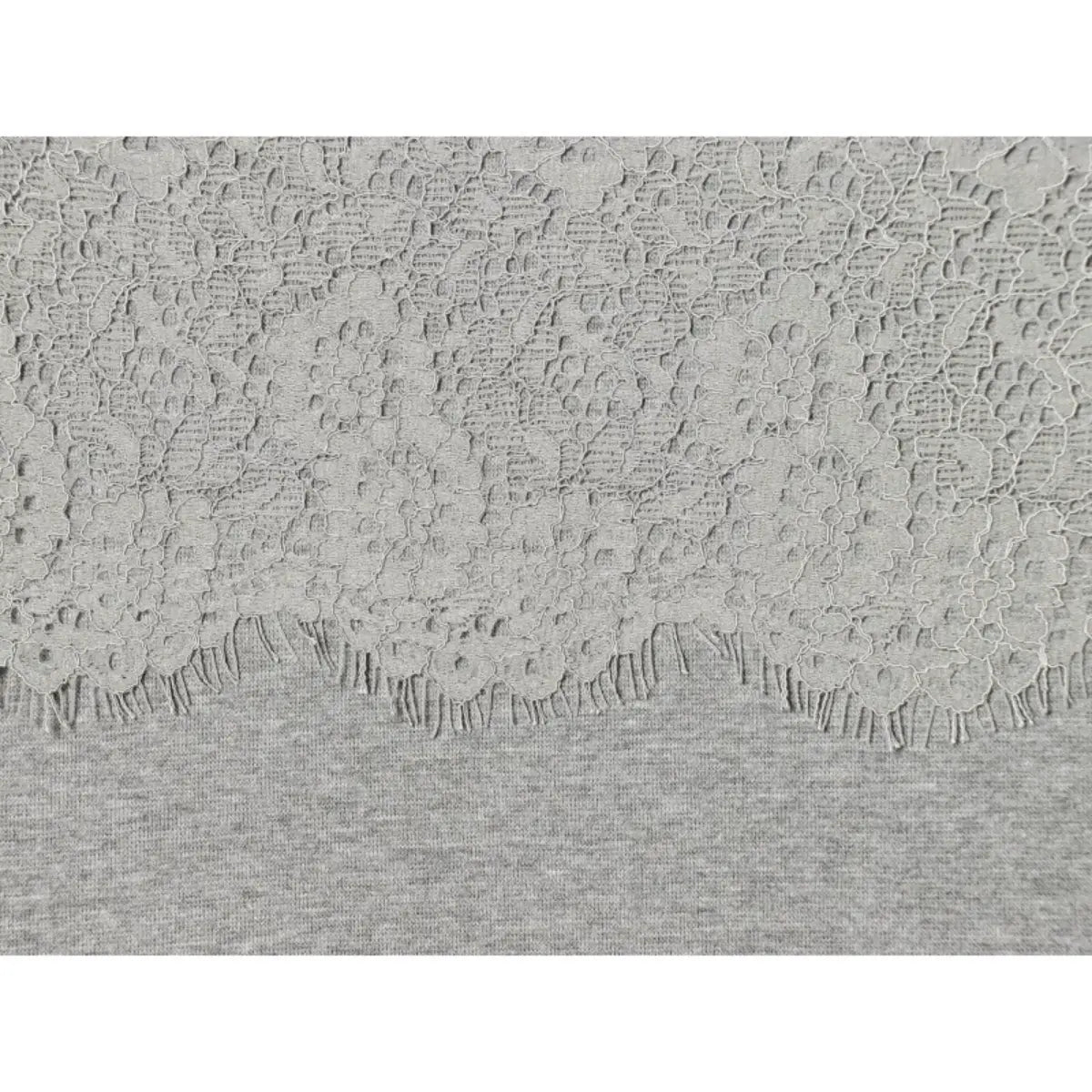Close-up of the lace-to-knit seam on the grey cami dress, showing the floral lace texture and scalloped edge