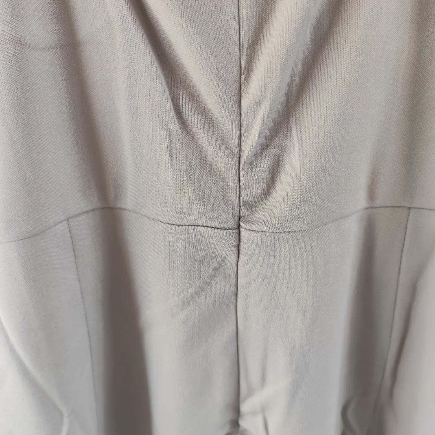 Close‑up view back seam and stitching detail of grey sleeveless bodycon midi dress