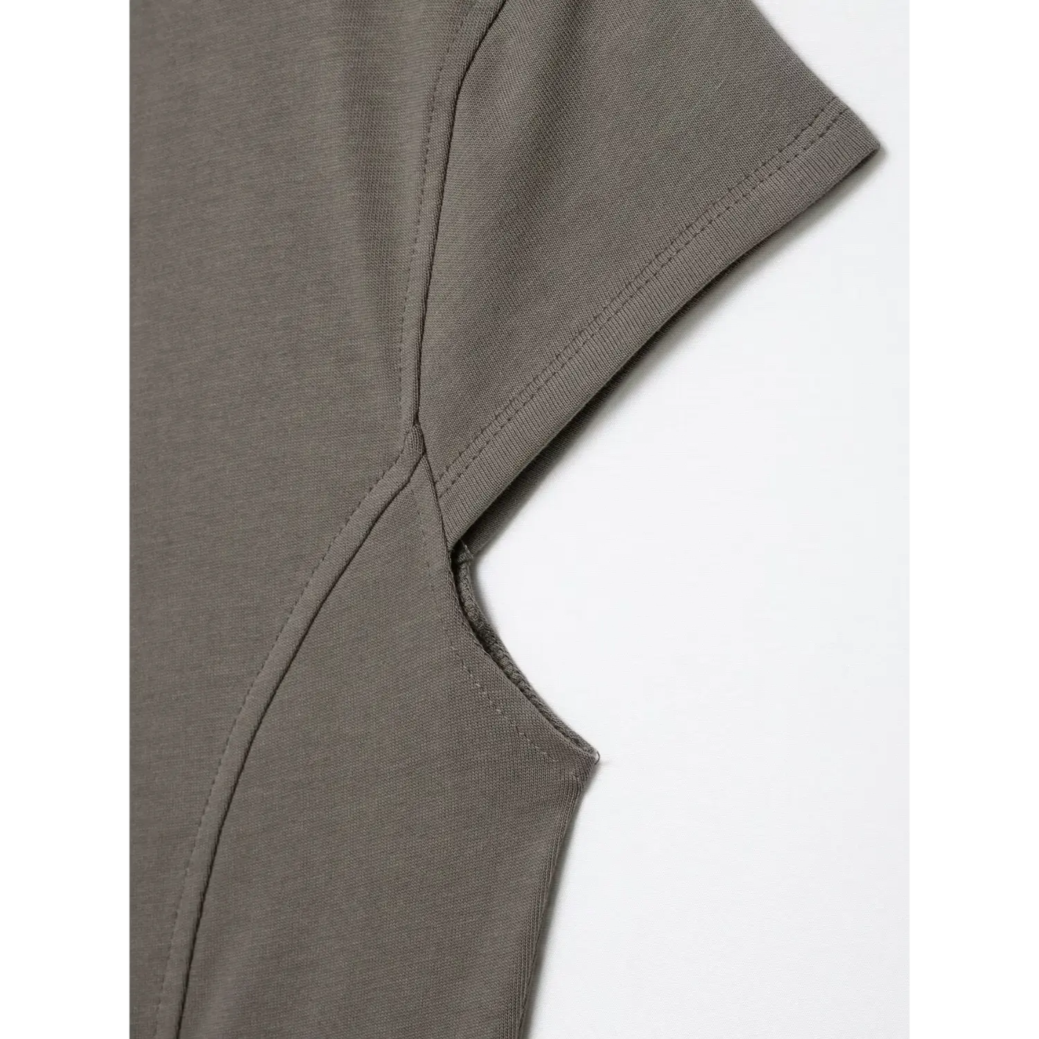 Close‑up cap sleeve and underarm seam construction of grey military‑style knit top