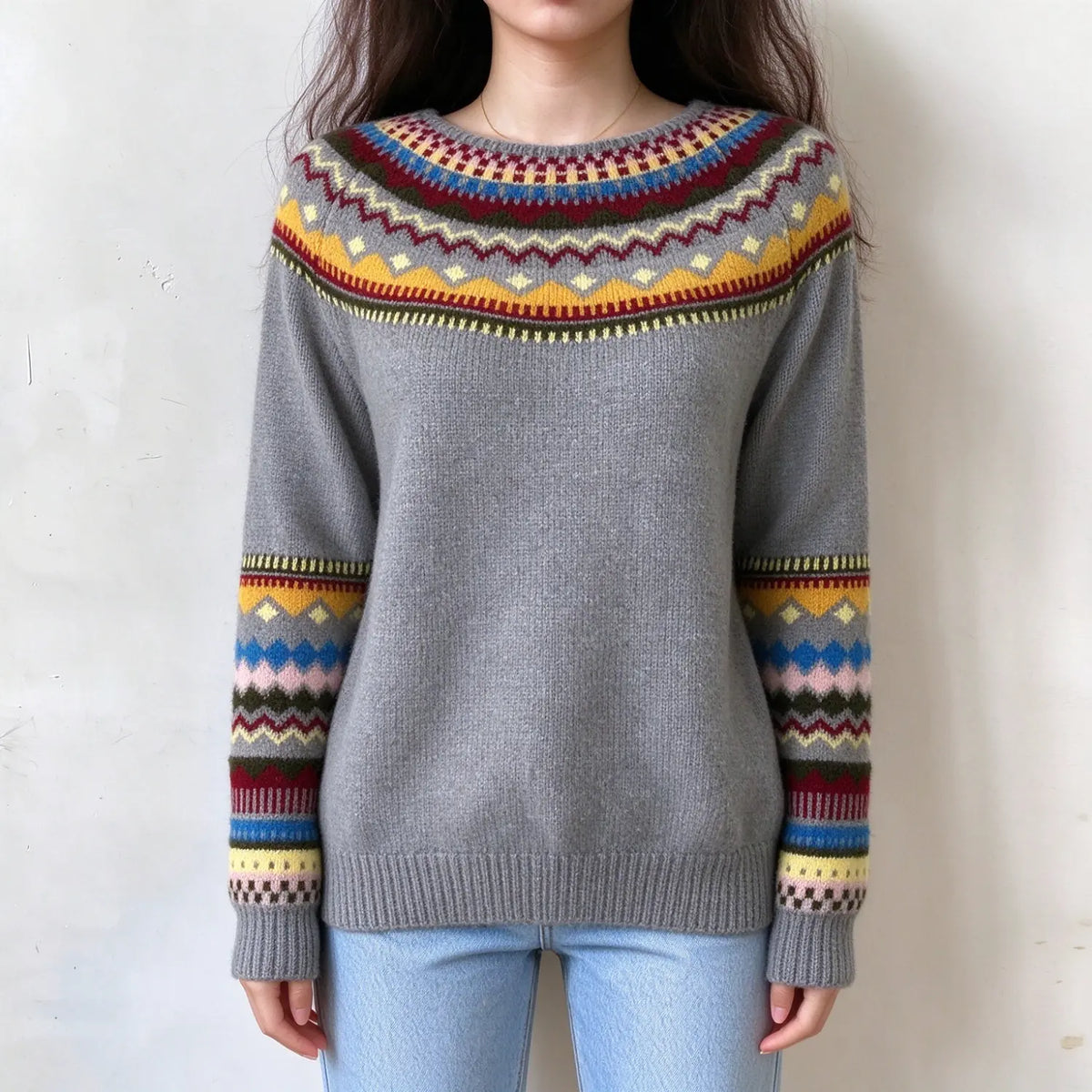 Female model wears grey fairisle sweater, colorful geometric jacquard on yoke and long sleeves, crew neck casual knit pullover