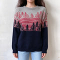 Female model wears grey navy fairisle pullover, pink and dark pine tree jacquard yoke, color block knit sweater, front shot
