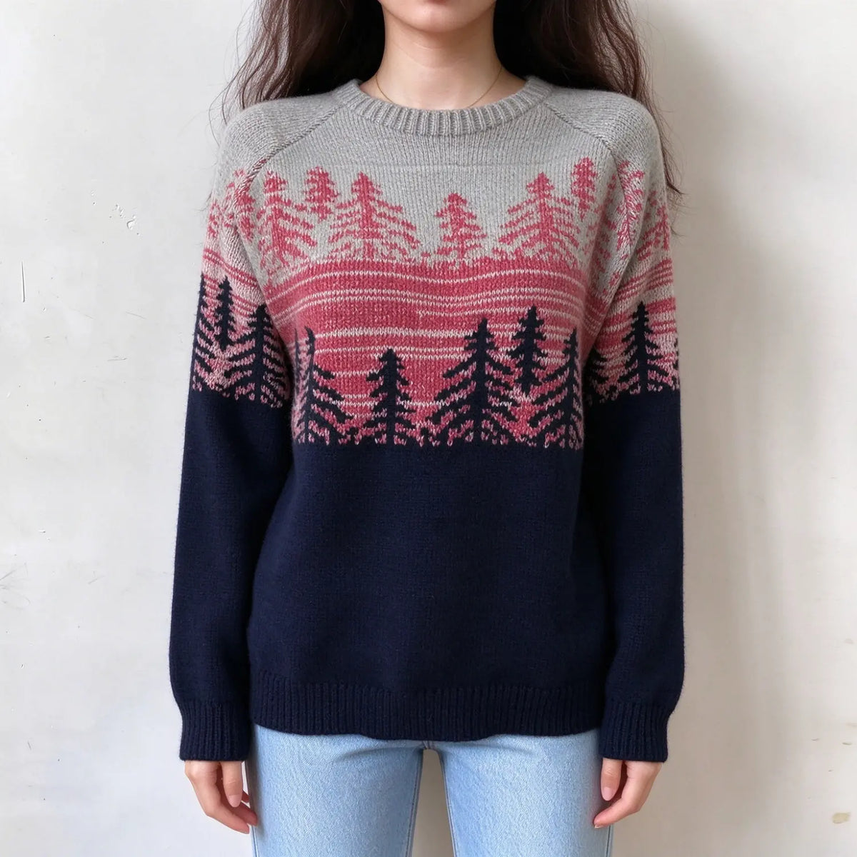Female model wears grey navy fairisle pullover, pink and dark pine tree jacquard yoke, color block knit sweater, front shot