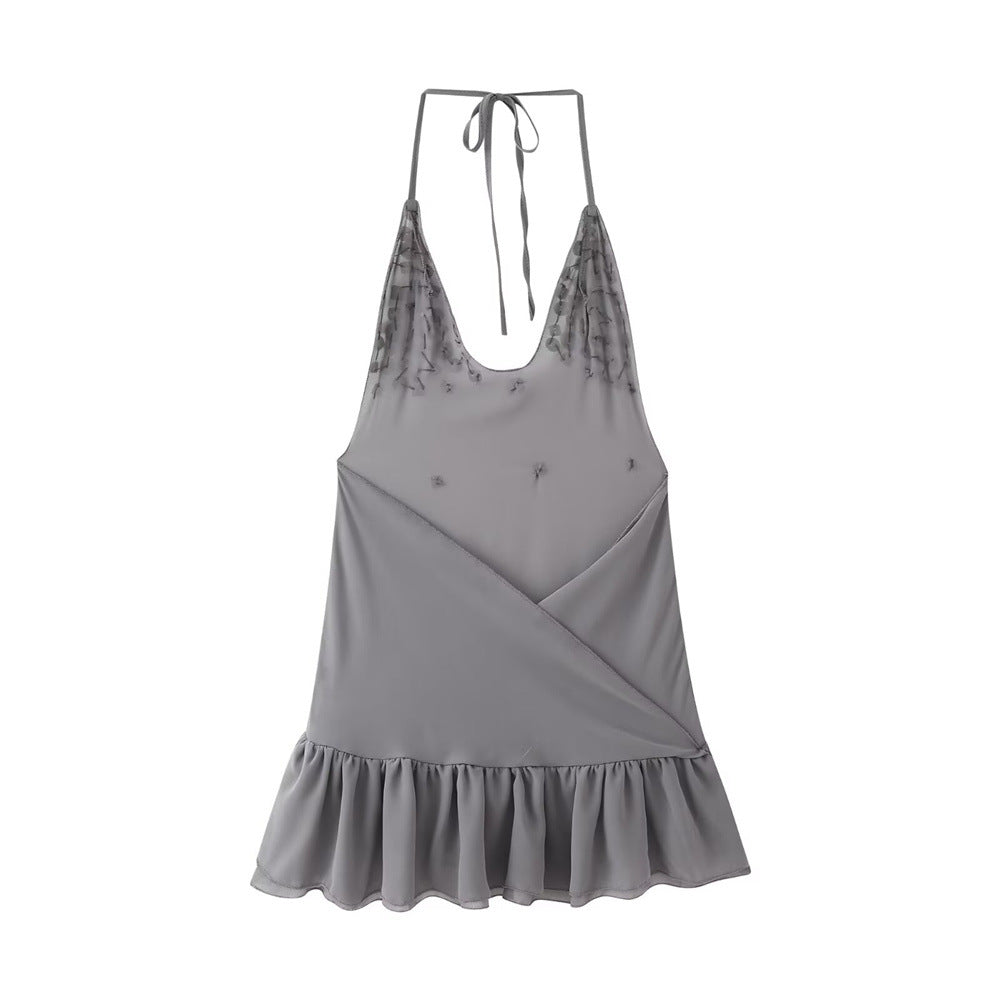  Back view of the grey shell button halter dress, showing the plain V-neck back, ruffled hem, and sheer upper section with subtle stitching