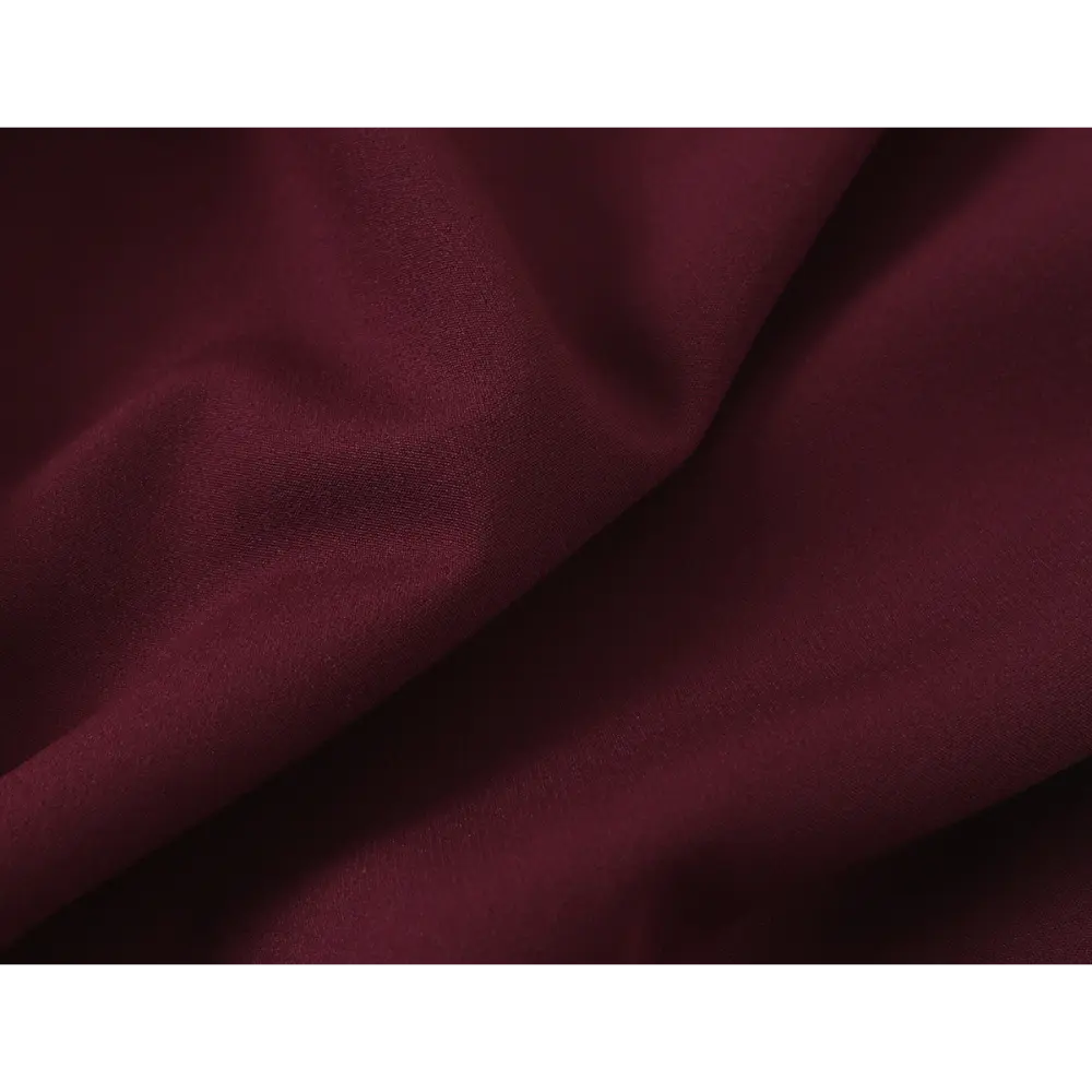 Close-up of burgundy smooth woven fabric