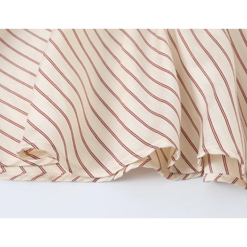 Close-up of diagonal striped flounce hem