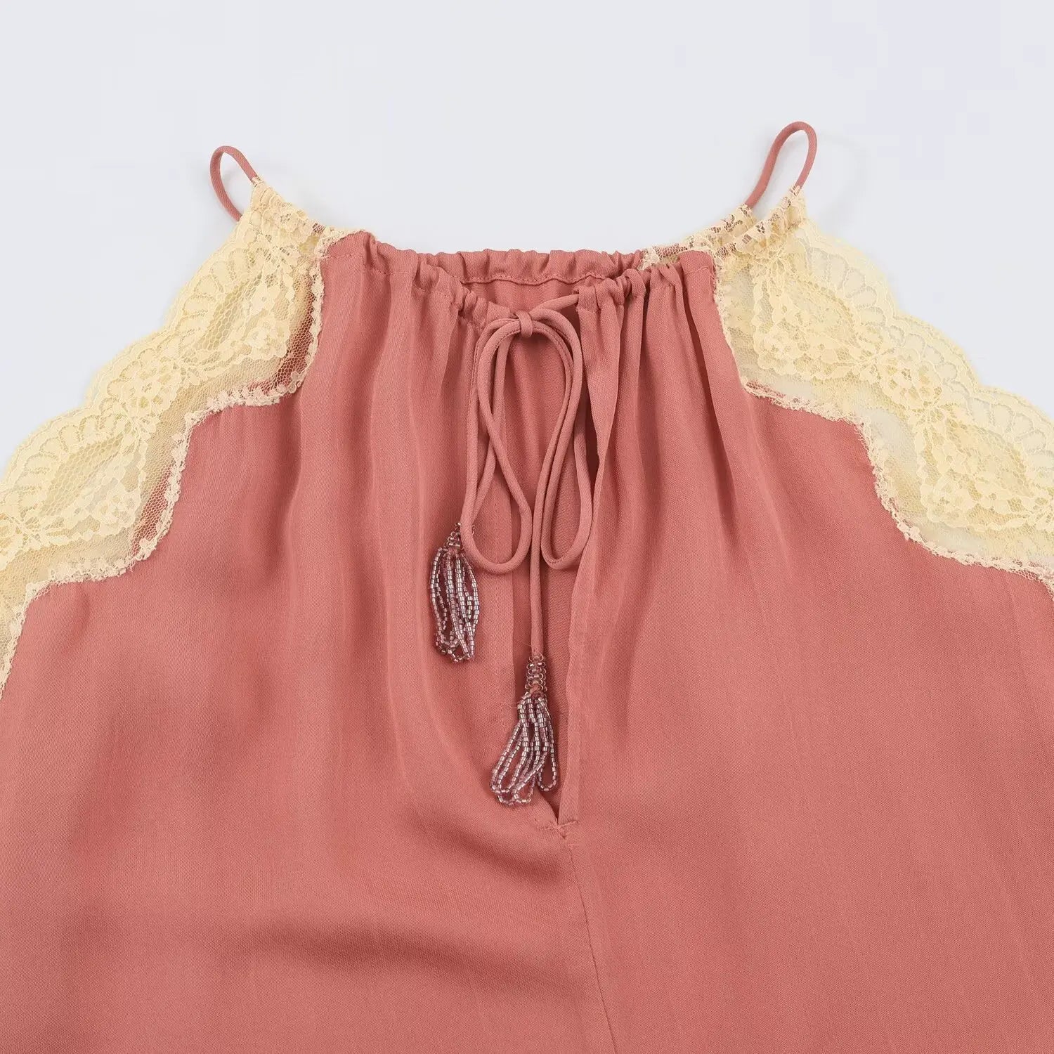 Flat back view of halter cami, keyhole opening with drawstring tie and crystal tassel charms