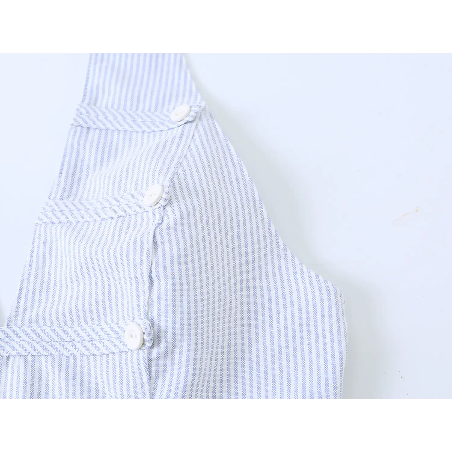 Side view decorative white buttons detail, fitted striped halter sleeveless top