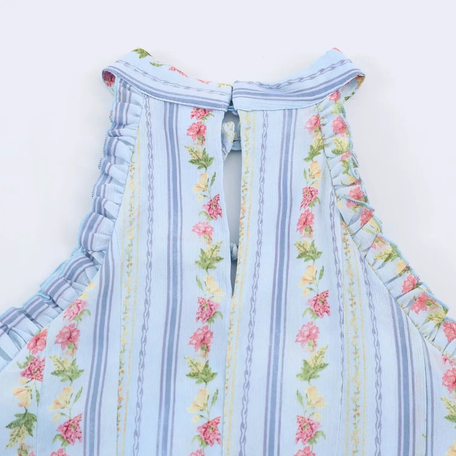 Front halter neck partial shot, hollow keyhole design, all-around ruffle trim, vertical stripe pink flower print chiffon