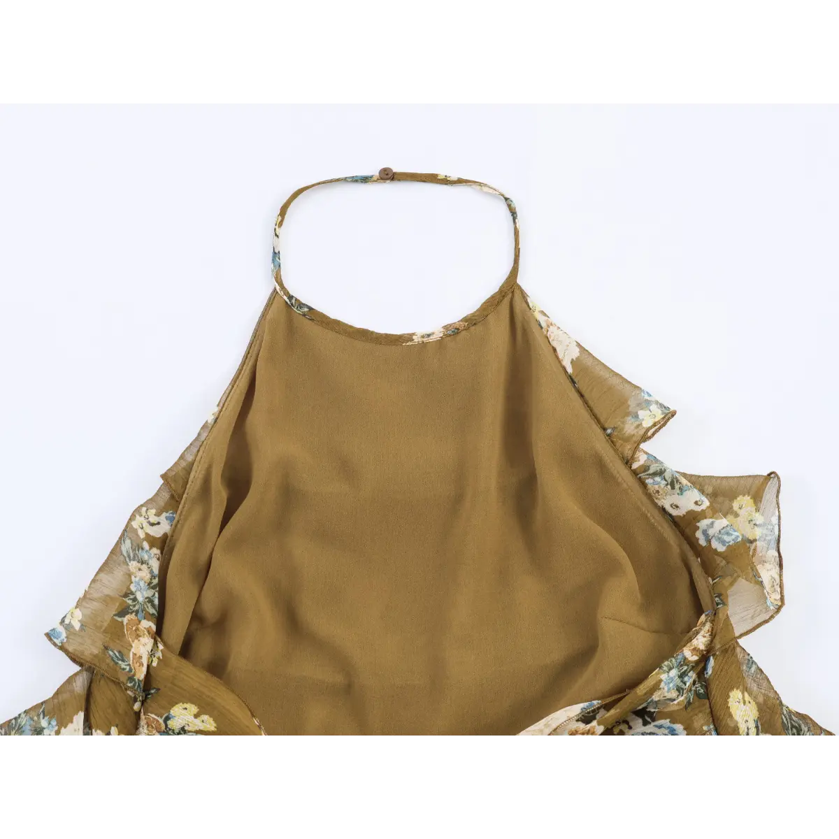 Inner back neck view, single button closure halter strap and full solid inner lining of tiered floral dress.