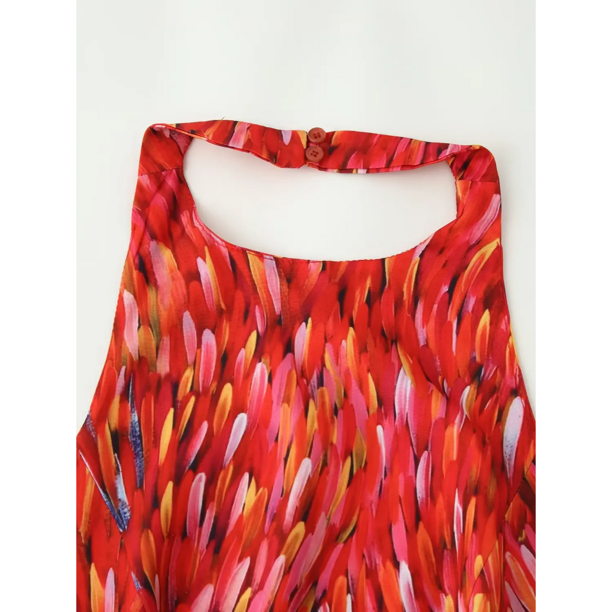 Close‑up back halter neck button closure red abstract print tiered maxi dress