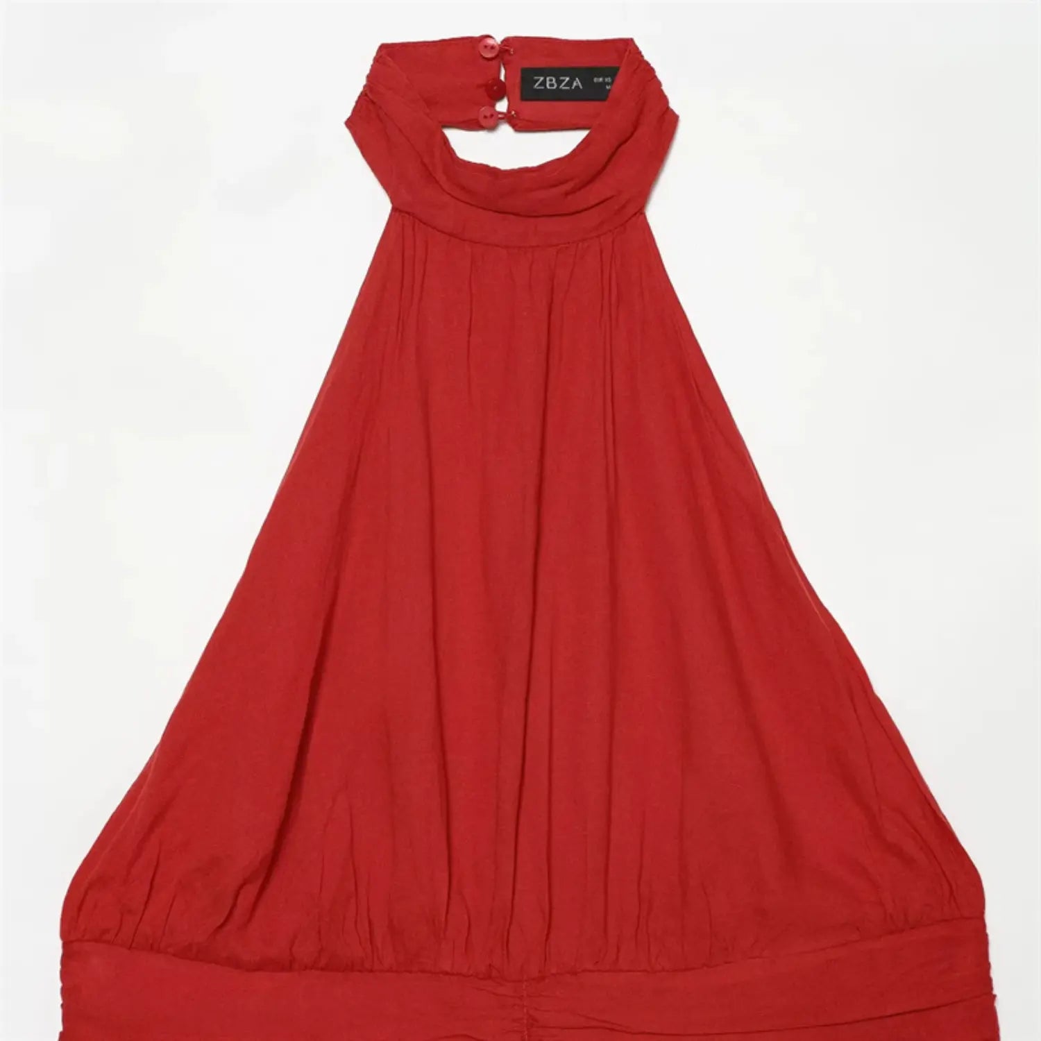 Upper torso close-up, draped halter neck, vertical bust gathering, smooth red woven fabric texture