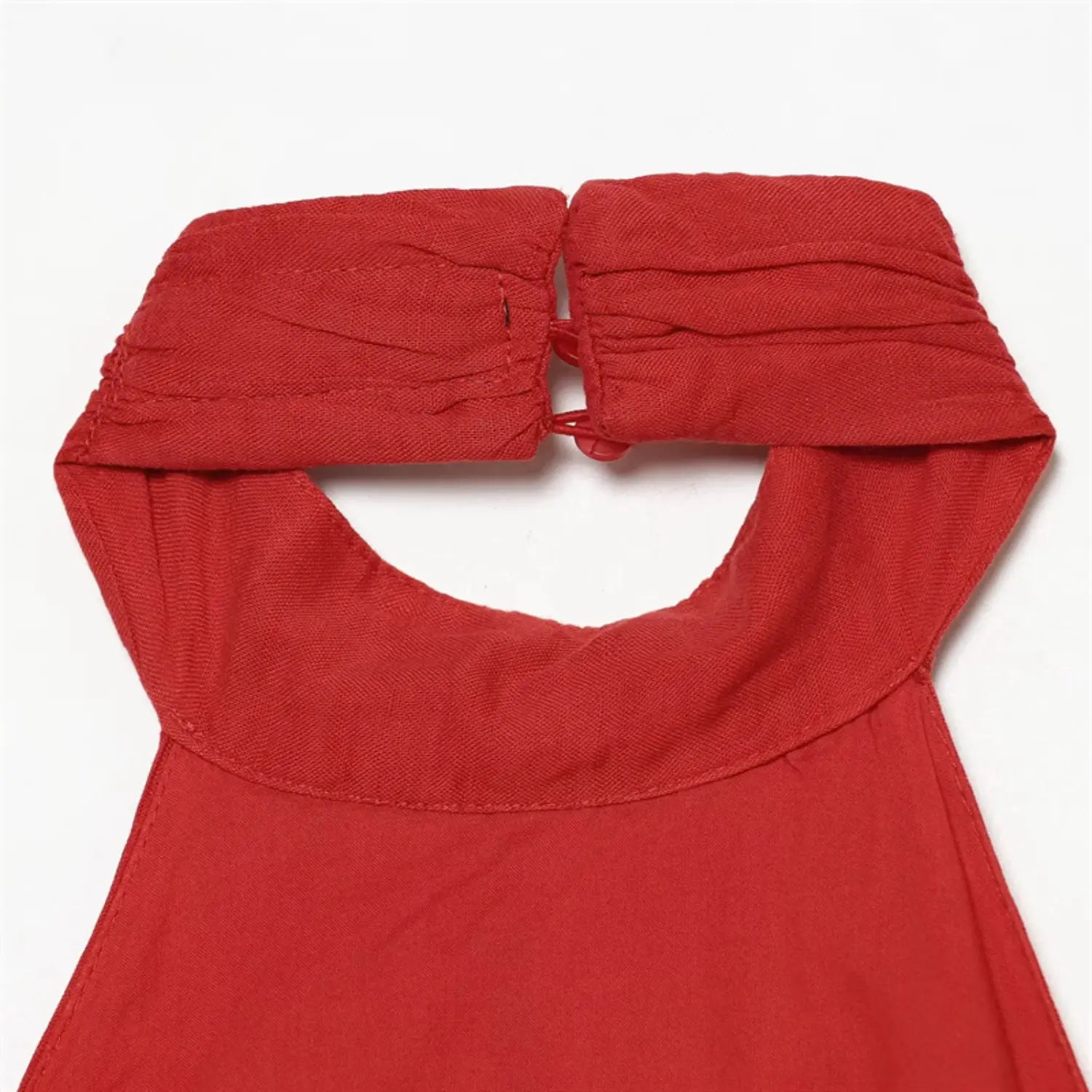 Rear halter neck partial shot, neckband gathering, back keyhole cutout, folded edge stitching