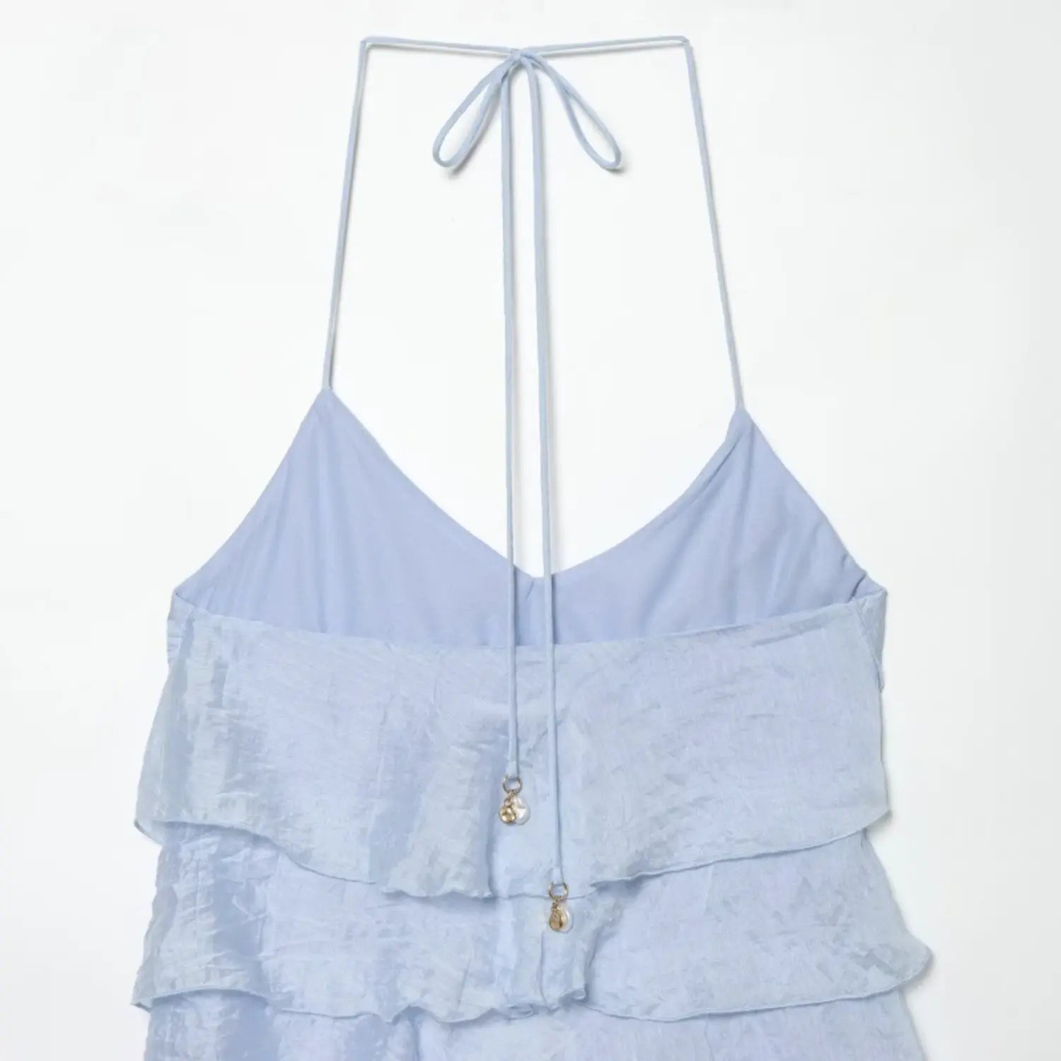 Inside back flat view of light blue halter mini dress, adjustable long self tie strap, solid matching inner lining