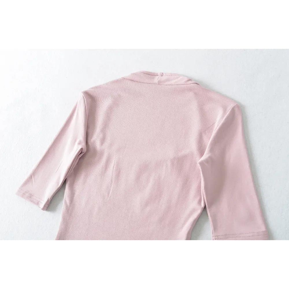Full back view on white background of the pink halter square-neck mid-sleeve top