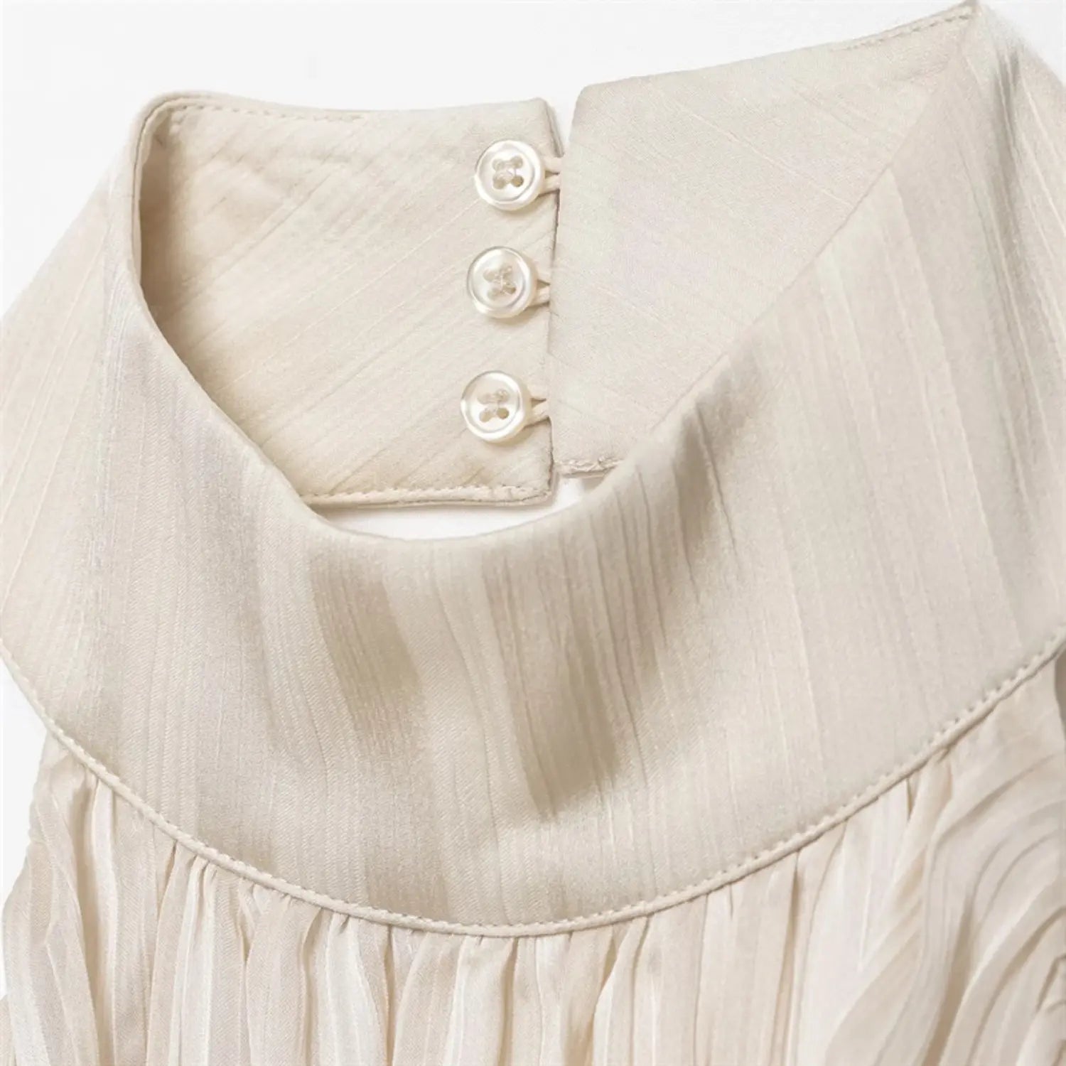 Neck back close-up, folded collar shaping and neat buttonhole stitching