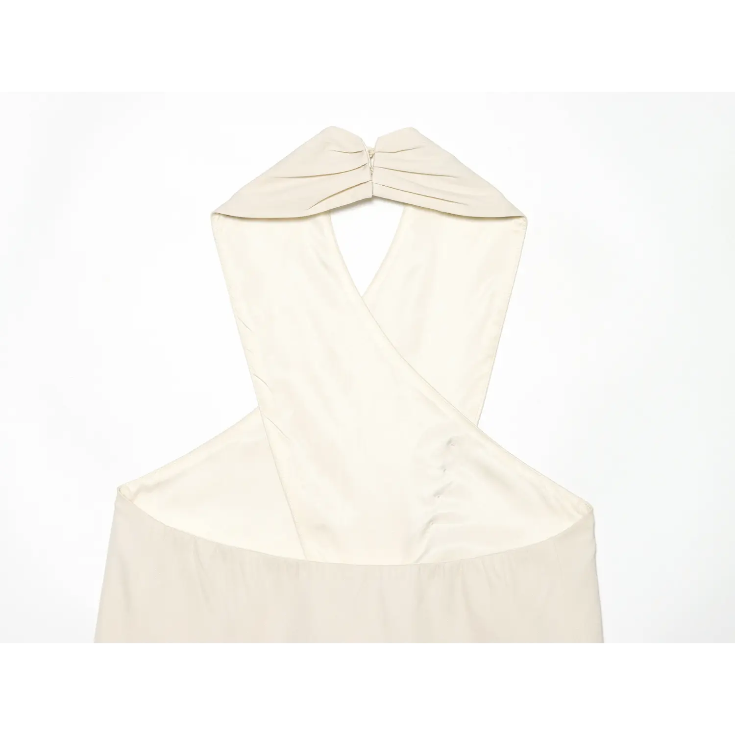 Rear close-up of gathered halter neck and lining of cream sleeveless top