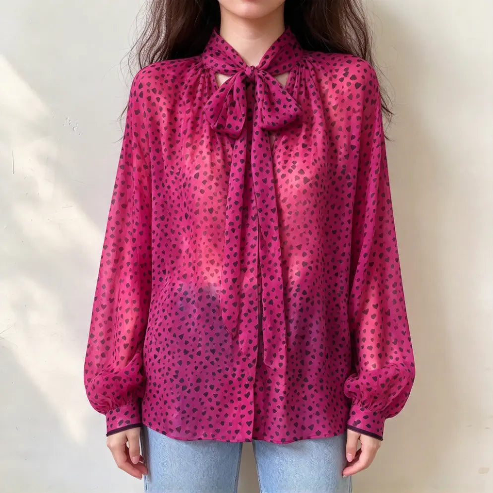 Model wearing heart print tie neck balloon sleeve chiffon blouse with jeans, front view