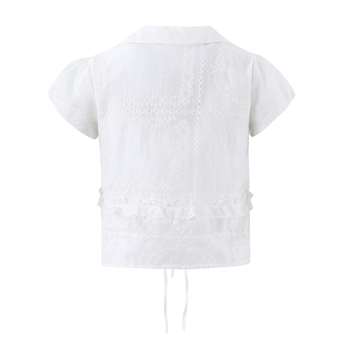 Women's white cropped blouse with heart embroidery, Peter Pan collar, tie front, and ruffle details, shown from the back.