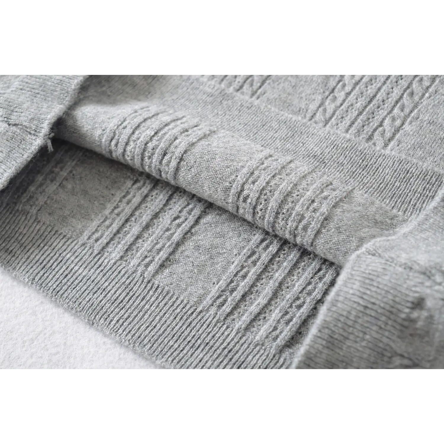 Side waist slim fit cable twist knit fabric close up, shaping vertical hollow knit cropped tee