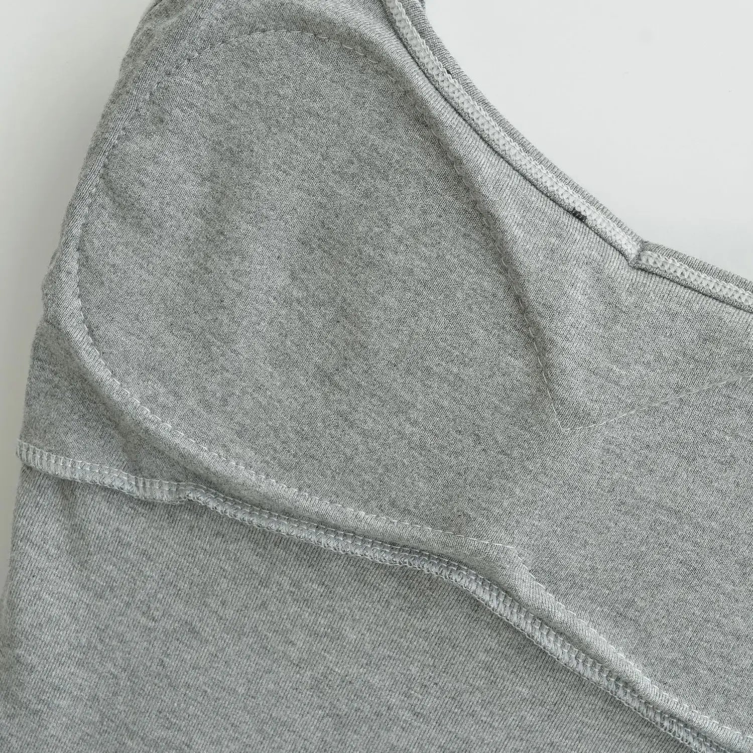 Heather gray dot knit cami bust lining flat detail, built-in padded vertical cut panels stretch knit edge stitching white background shot