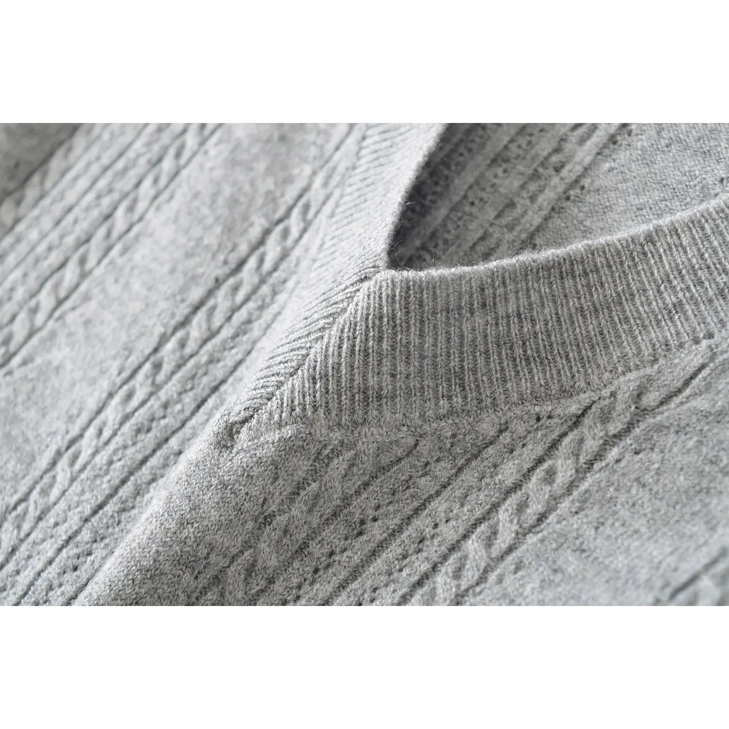 Macro closeup deep v neck rib binding detail, soft fine cable twist knit fabric women short sleeve top