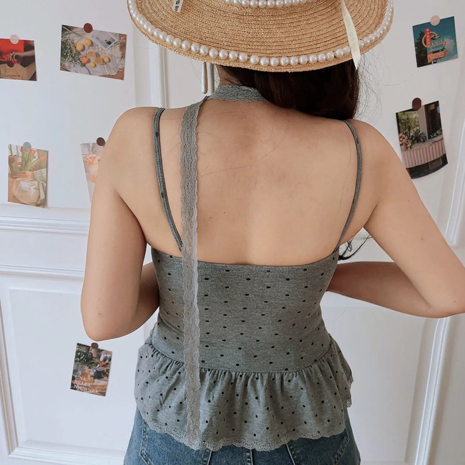 Heather gray black polka dot knit cami back view model shot, lace choker lace peplum hem matched with denim shorts indoor outfit photo
