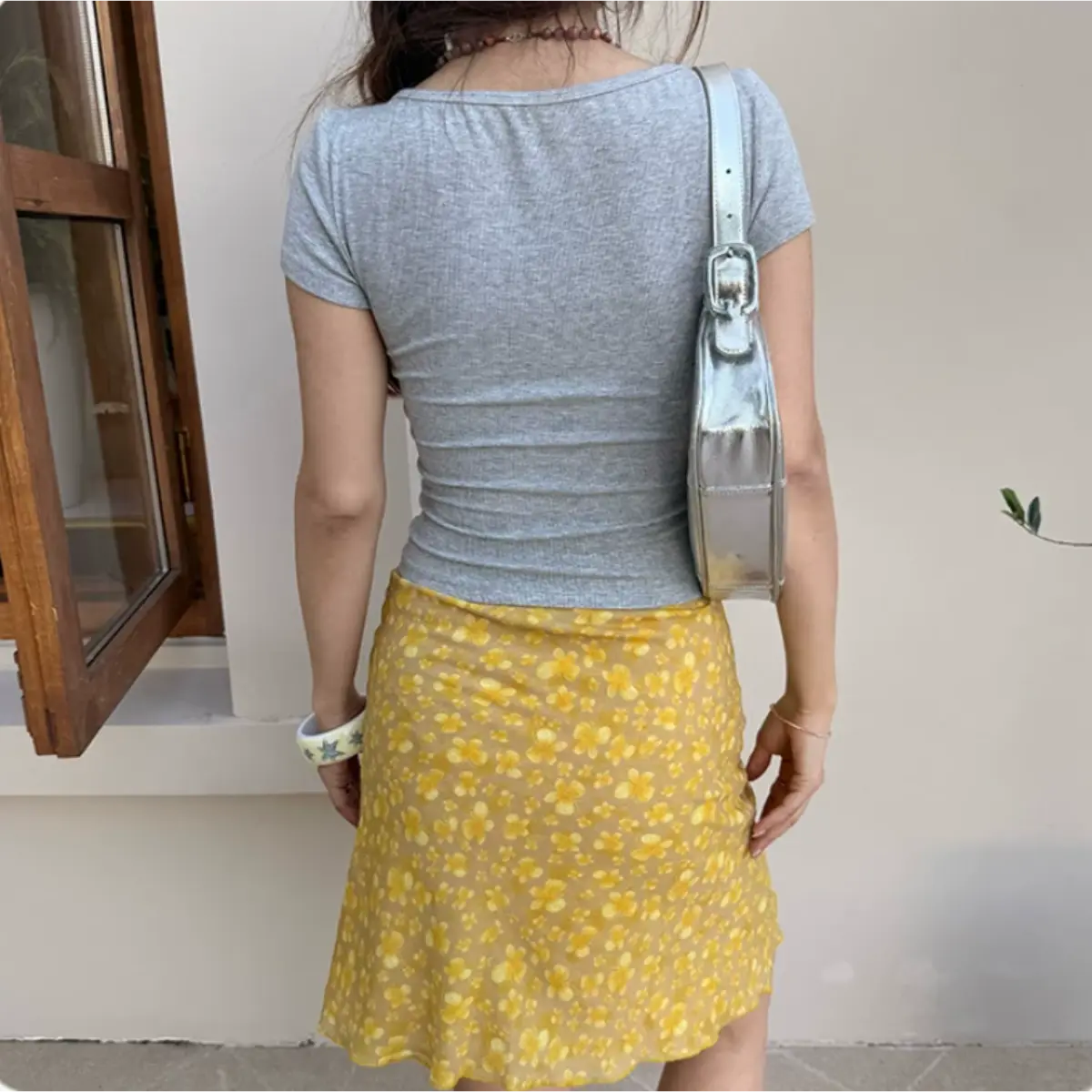 Full back indoor shot heather gray ribbed slim fit v-neck cropped short sleeve knit top