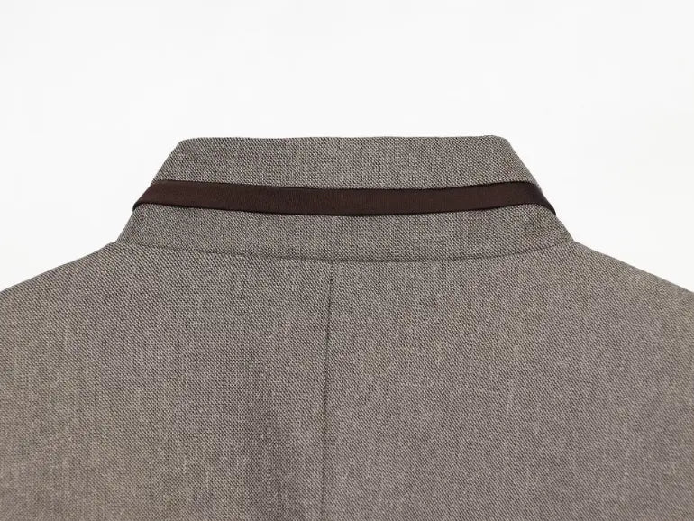 Close-up of back stand collar dark brown trim