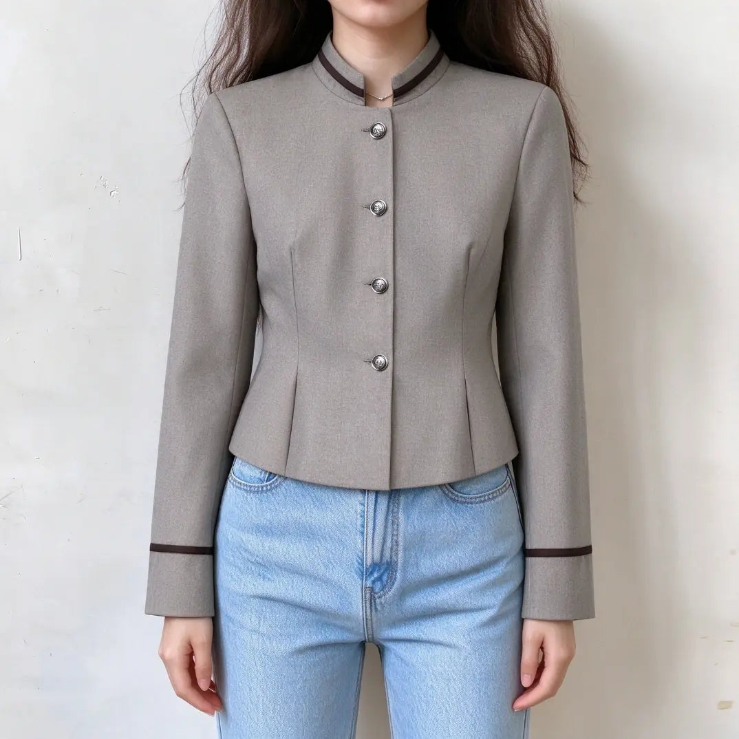 Model wearing heather grey contrast trim stand collar cropped jacket with jeans, front view
