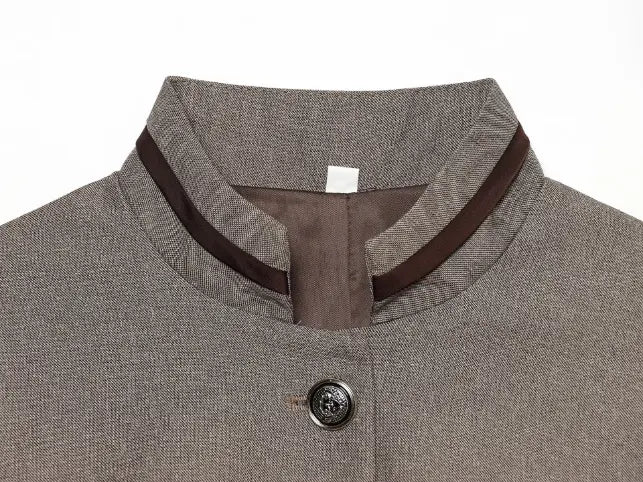 Close-up of stand collar with dark brown contrast trim