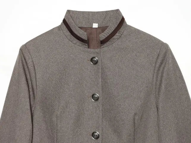 Close-up of stand collar and silver-tone button placket