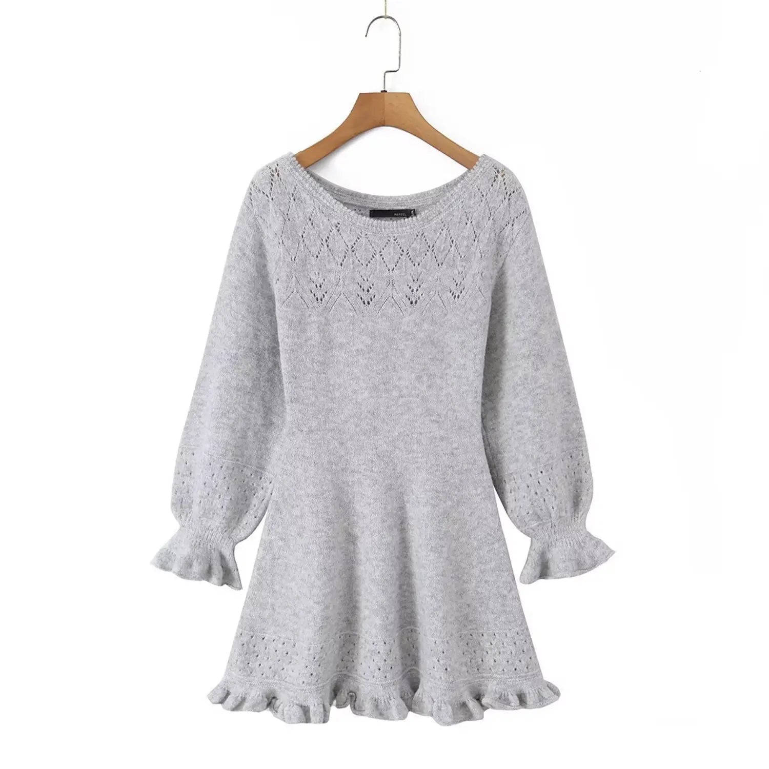 Hanging full shot of heather grey lace knit mini dress mounted on wooden clothes hanger against white wall