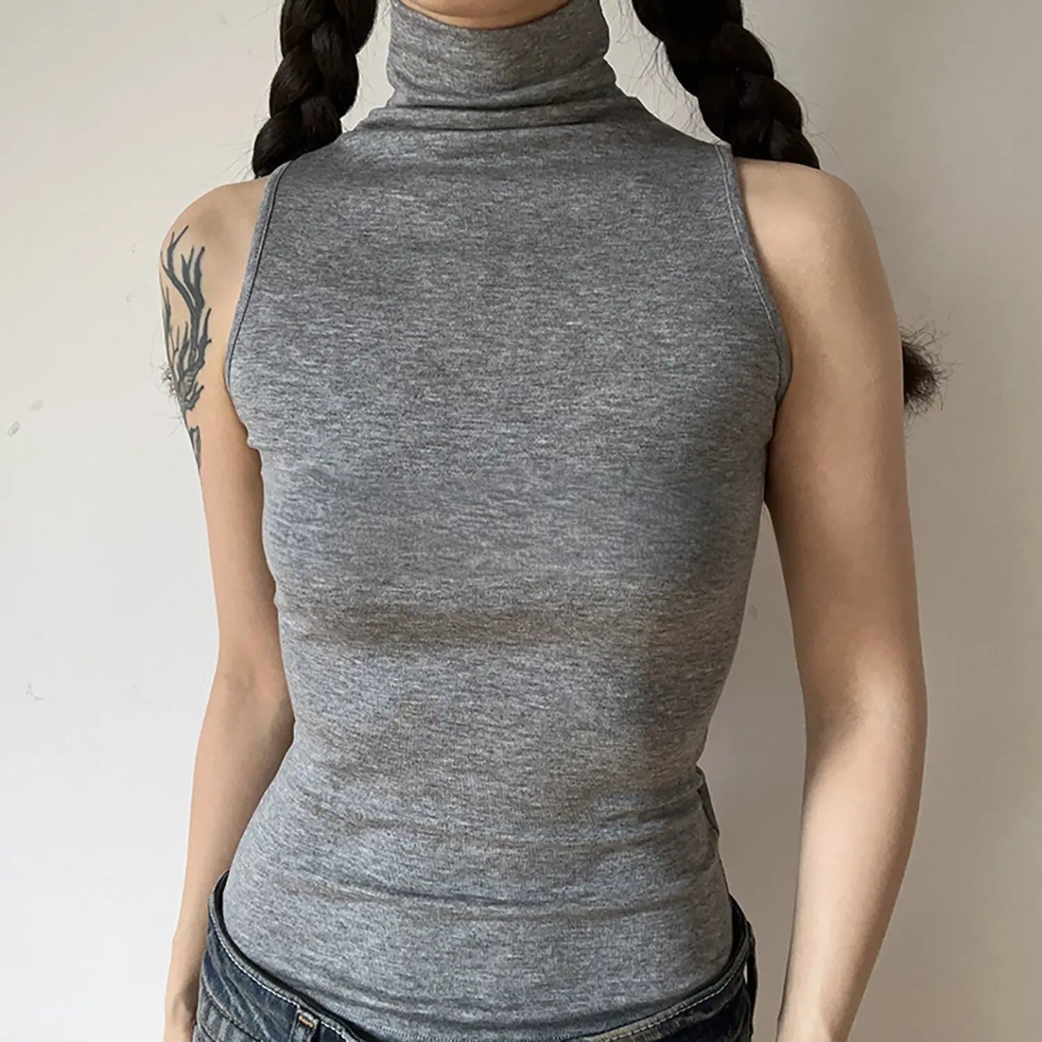Front torso view, heather gray sleeveless high turtleneck tank top, soft stretch knit
