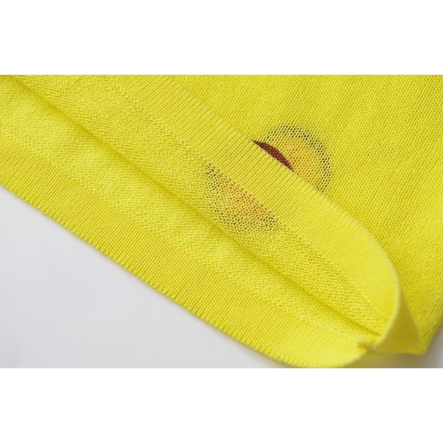 Hem stitching close-up, rib edge construction, fine thin knit weave texture